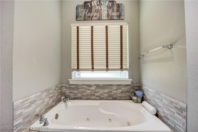 bathroom with a whirlpool tub