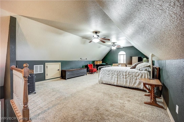 carpeted bedroom featuring vaulted ceiling, baseboards, a textured ceiling, and ceiling fan