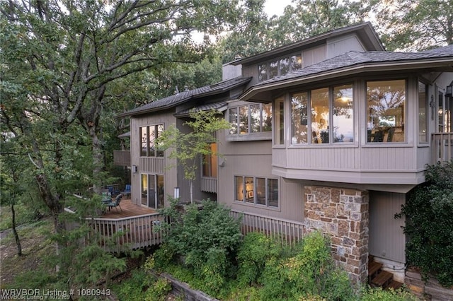 10301 Stoneleige St, Fort Smith, AR 72908 - rear view of property with a wooden deck, a balcony, and stone siding