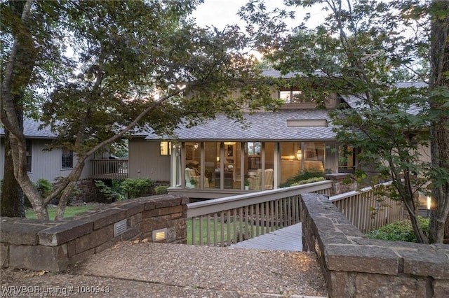 10301 Stoneleige St, Fort Smith, AR 72908 - rear view of property with a sunroom and a shingled roof