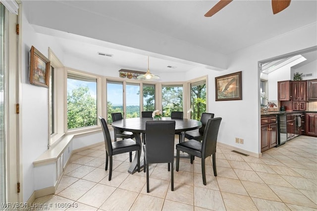 10301 Stoneleige St, Fort Smith, AR 72908 - dining space featuring a ceiling fan, baseboards, light tile patterned floors, beam ceiling, and wine cooler