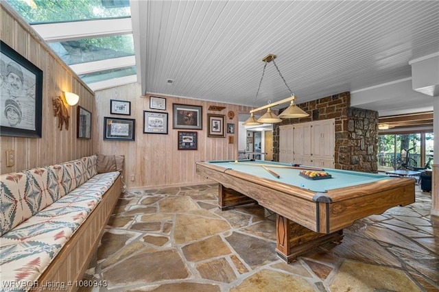 10301 Stoneleige St, Fort Smith, AR 72908 - recreation room with stone flooring, billiards table, lofted ceiling, and wooden walls