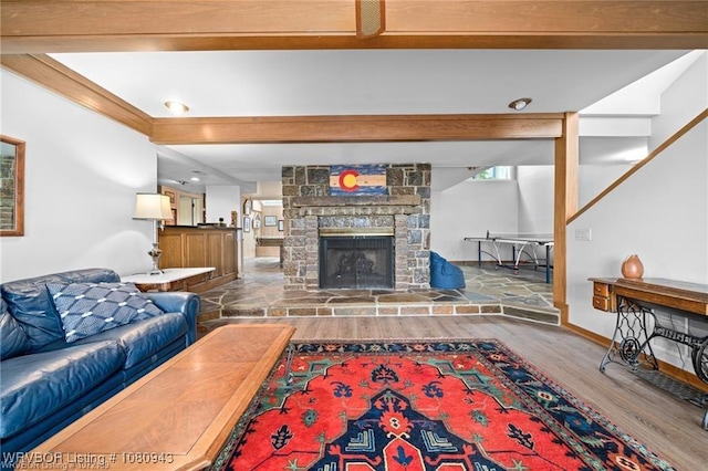 10301 Stoneleige St, Fort Smith, AR 72908 - living room featuring wood finished floors, a stone fireplace, recessed lighting, beamed ceiling, and baseboards
