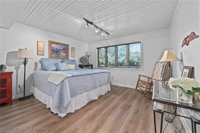 10301 Stoneleige St, Fort Smith, AR 72908 - bedroom featuring baseboards, light wood-style flooring, track lighting, ornamental molding, and wood ceiling
