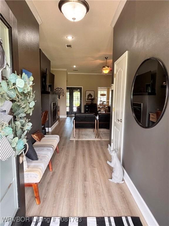 2420 Keystone Cir, Mulberry, AR 73947 - corridor with light wood-type flooring and ornamental molding