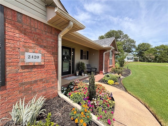 2420 Keystone Cir, Mulberry, AR 73947 - property entrance with a yard and brick siding
