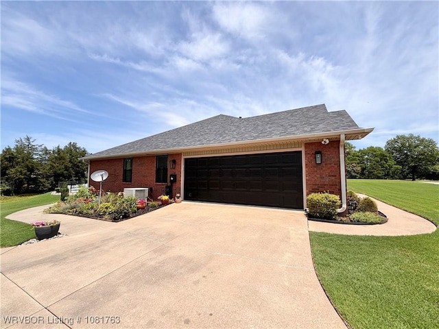 2420 Keystone Cir, Mulberry, AR 73947 - view of front facade featuring a front lawn, concrete driveway, brick siding, an attached garage, and a shingled roof