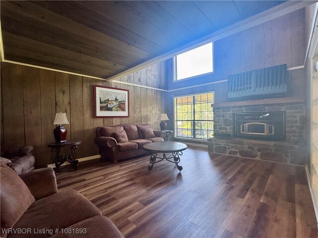 4018 Blue Hole Rd, Rudy, AR 72952 - living area with wood ceiling, wood walls, a stone fireplace, wood finished floors, and vaulted ceiling