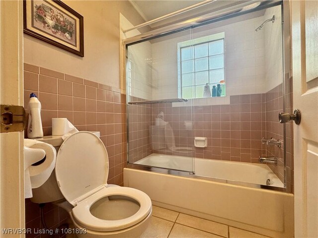 4018 Blue Hole Rd, Rudy, AR 72952 - bathroom featuring tile walls, bath / shower combo with glass door, and tile patterned floors