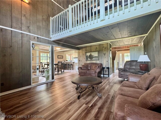 4018 Blue Hole Rd, Rudy, AR 72952 - living room with wood walls, wood finished floors, wooden ceiling, and a high ceiling