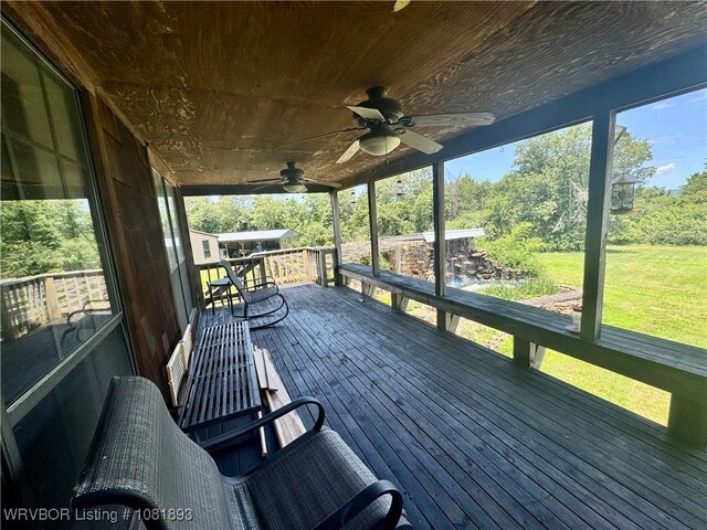 4018 Blue Hole Rd, Rudy, AR 72952 - wooden terrace featuring a ceiling fan and a yard