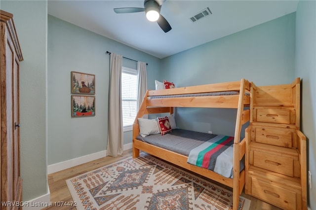 bedroom featuring ceiling fan and light hardwood / wood-style flooring