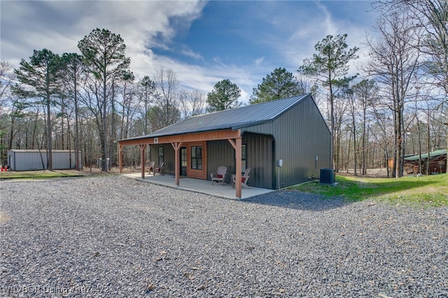 view of outdoor structure featuring central AC unit