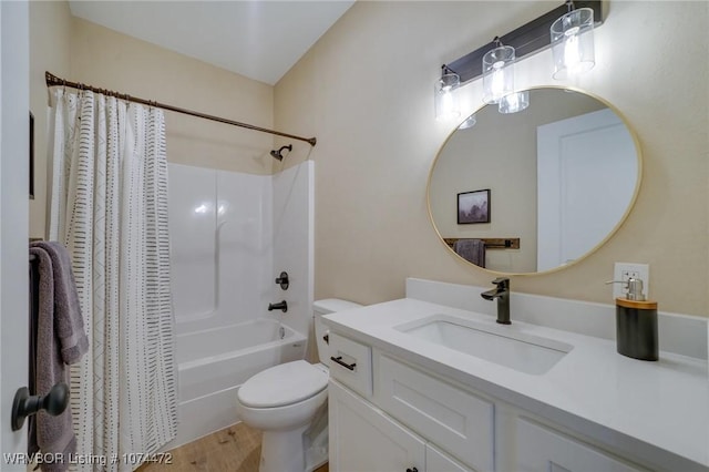 full bathroom with hardwood / wood-style floors, vanity, toilet, and shower / bathtub combination with curtain