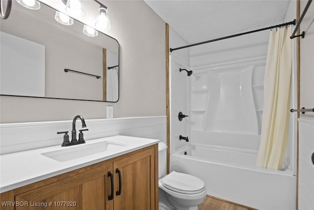 full bathroom featuring hardwood / wood-style flooring, vanity, toilet, and shower / bath combo