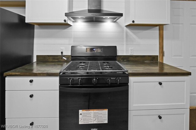 43801 Xn Rnch, Talihina, OK 74571 - kitchen with gas stove, white cabinetry, and wall chimney exhaust hood
