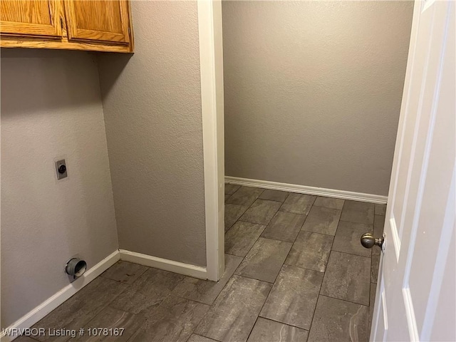 clothes washing area with hookup for an electric dryer and cabinets