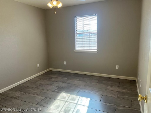 unfurnished room with ceiling fan