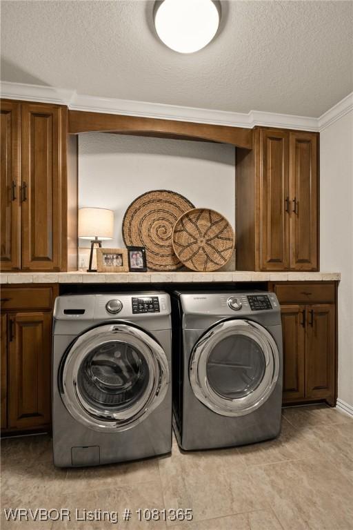 8404 Gatehouse Way, Fort Smith, AR 72916 - washroom with independent washer and dryer, cabinet space, a textured ceiling, and ornamental molding