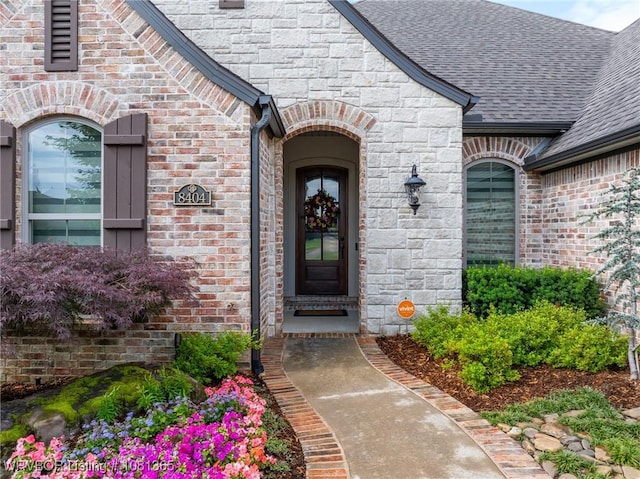 8404 Gatehouse Way, Fort Smith, AR 72916 - doorway to property with roof with shingles, brick siding, and stone siding