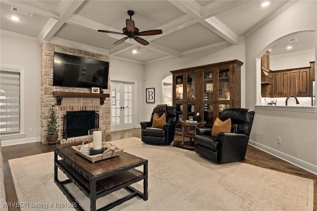 8404 Gatehouse Way, Fort Smith, AR 72916 - living room featuring arched walkways, a ceiling fan, coffered ceiling, beamed ceiling, and dark wood-style flooring