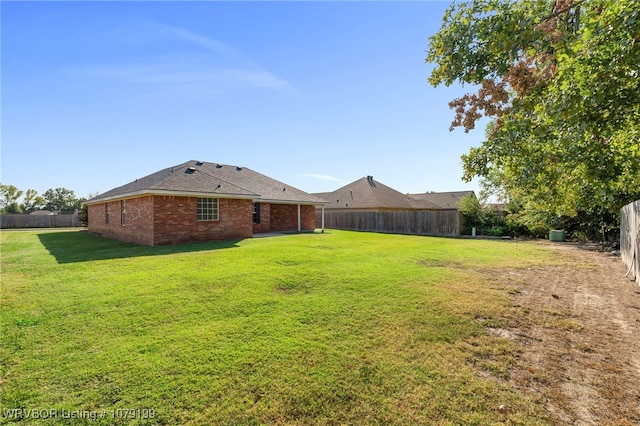 view of yard featuring a fenced backyard