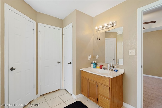 bathroom featuring baseboards, vanity, and tile patterned floors