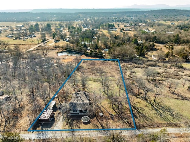 bird's eye view featuring a mountain view and a rural view