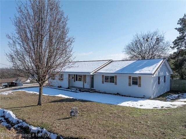 ranch-style house featuring a yard