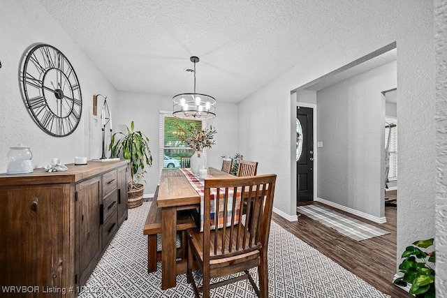 2509 Roxbury Ln, Fort Smith, AR 72908 - dining room with a textured ceiling, wood finished floors, a chandelier, and a textured wall