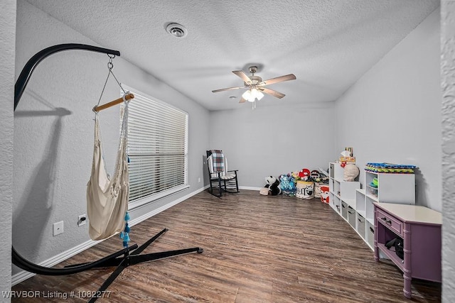 2509 Roxbury Ln, Fort Smith, AR 72908 - playroom featuring wood finished floors, ceiling fan, and a textured ceiling