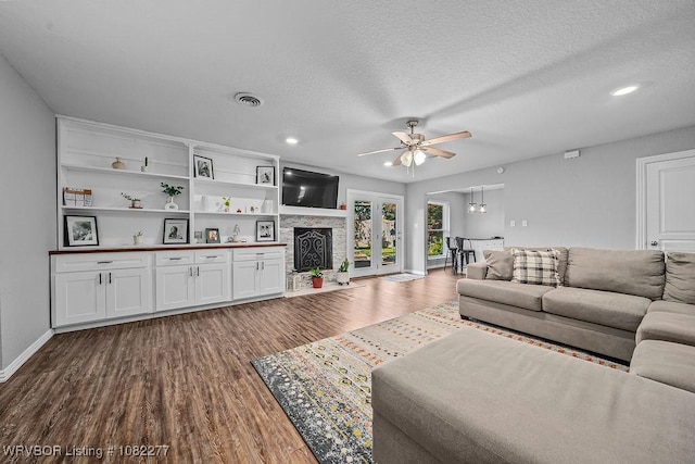 2509 Roxbury Ln, Fort Smith, AR 72908 - living area with dark wood-style floors, a ceiling fan, a textured ceiling, and recessed lighting