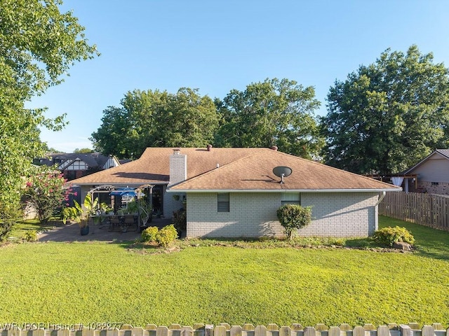 2509 Roxbury Ln, Fort Smith, AR 72908 - view of home's exterior featuring a patio, brick siding, and a chimney
