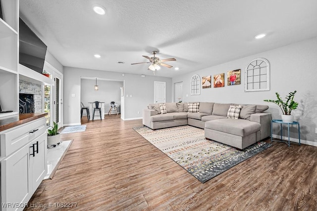 2509 Roxbury Ln, Fort Smith, AR 72908 - living room featuring wood finished floors, ceiling fan, recessed lighting, and a textured ceiling