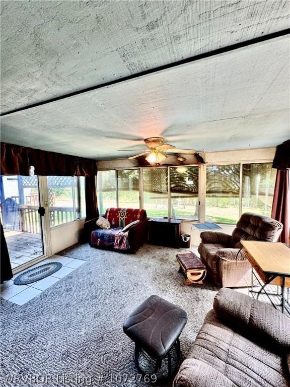 sunroom / solarium with ceiling fan