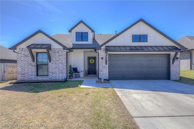 view of front of home with a garage and a front lawn