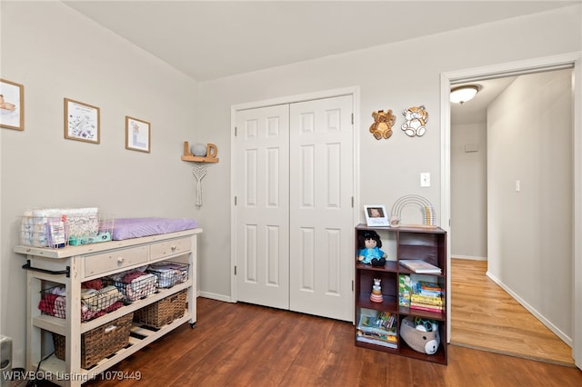 rec room featuring wood finished floors and baseboards