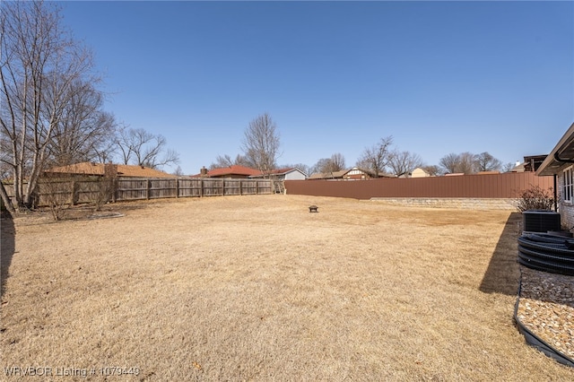 view of yard featuring a fenced backyard and cooling unit