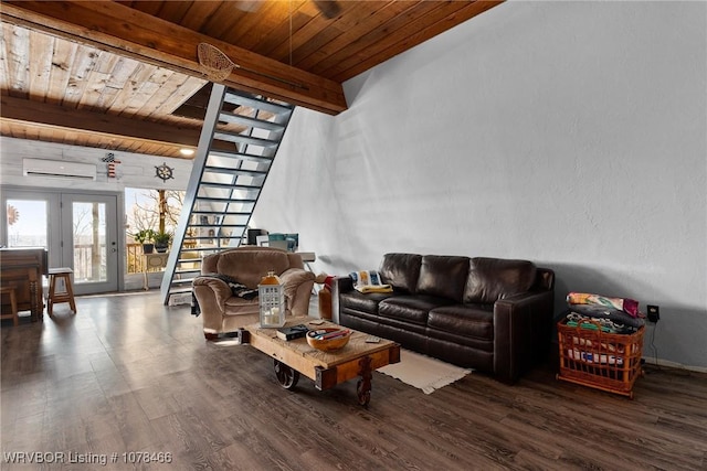 living room featuring french doors, beam ceiling, wood ceiling, and a wall mounted air conditioner