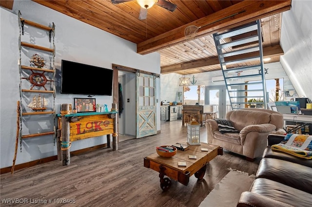 living room featuring wood ceiling, hardwood / wood-style flooring, ceiling fan, beam ceiling, and a barn door