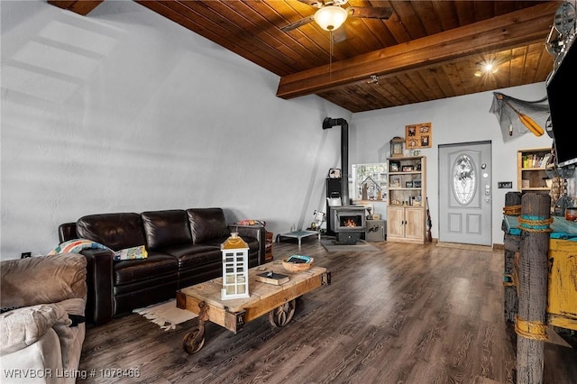 living room with hardwood / wood-style flooring, wooden ceiling, ceiling fan, a wood stove, and beam ceiling