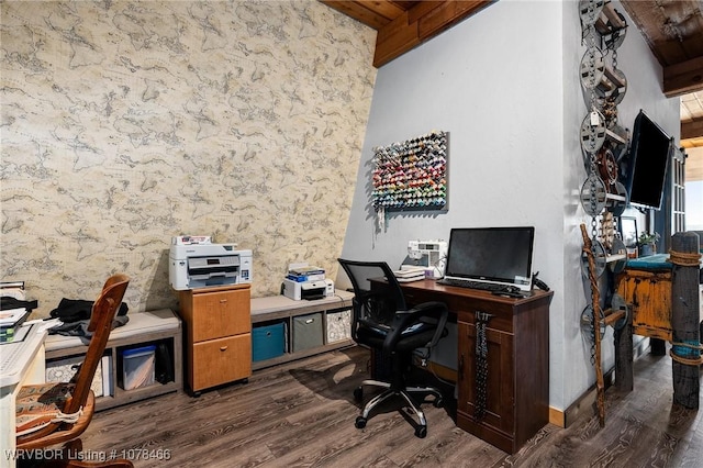 office space with beam ceiling, dark hardwood / wood-style flooring, and wooden ceiling