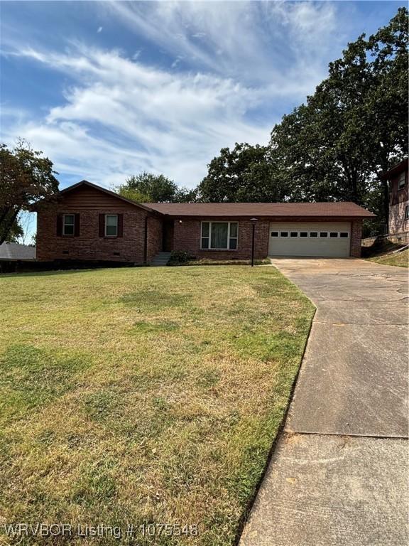 ranch-style home with a front lawn