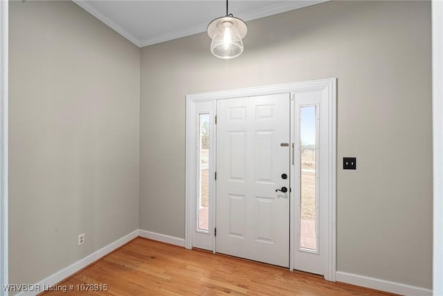 foyer with crown molding and light wood-type flooring