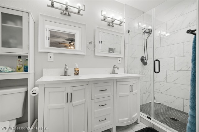 908 N 5th Ter, Barling, AR 72923 - full bath with marble look tile flooring, toilet, a stall shower, double vanity, and a ceiling fan