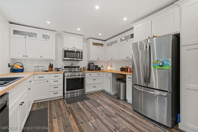 908 N 5th Ter, Barling, AR 72923 - kitchen with stainless steel appliances, butcher block countertops, decorative backsplash, and recessed lighting