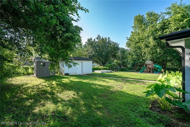 908 N 5th Ter, Barling, AR 72923 - view of green lawn featuring a playground