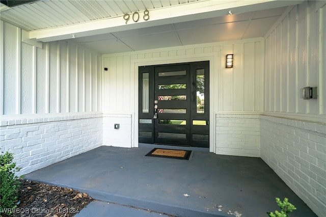 908 N 5th Ter, Barling, AR 72923 - property entrance featuring board and batten siding