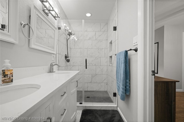 908 N 5th Ter, Barling, AR 72923 - bathroom with double vanity, a shower stall, and recessed lighting