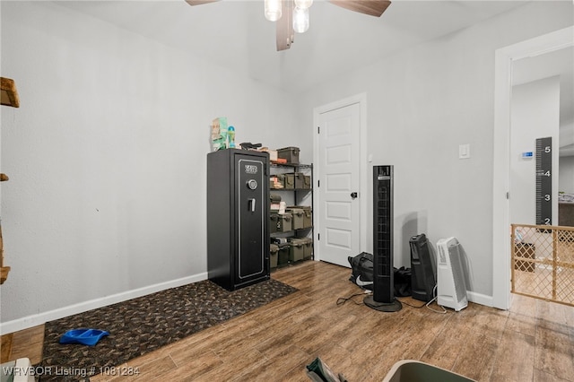 908 N 5th Ter, Barling, AR 72923 - workout room with wood finished floors, baseboards, and a ceiling fan